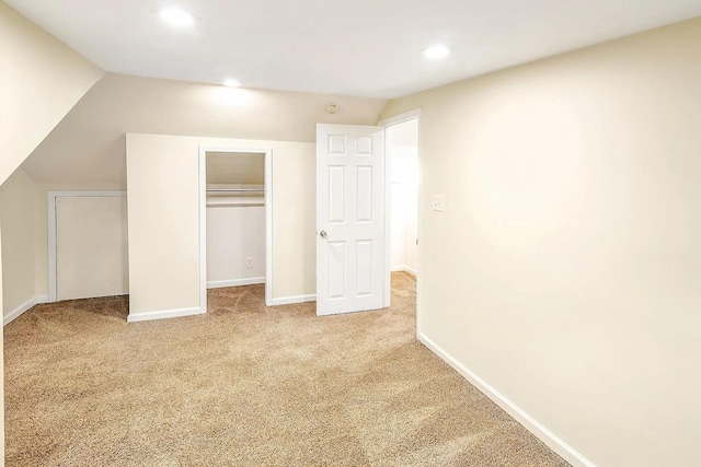 2401 Vaulx Ln, Nashville, TN 37204 - unfurnished bedroom with carpet flooring, recessed lighting, a closet, baseboards, and lofted ceiling