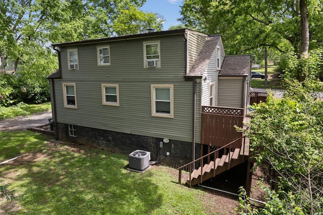 2401 Vaulx Ln, Nashville, TN 37204 - back of house featuring central air condition unit, stairs, a lawn, and a deck