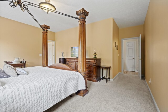 3615 Legacy Dr, Springfield, TN 37172 - bedroom with light colored carpet, ornate columns, and baseboards
