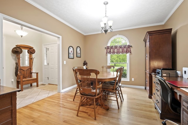 3615 Legacy Dr, Springfield, TN 37172 - dining space with light wood-style flooring, a chandelier, a desk, crown molding, and baseboards