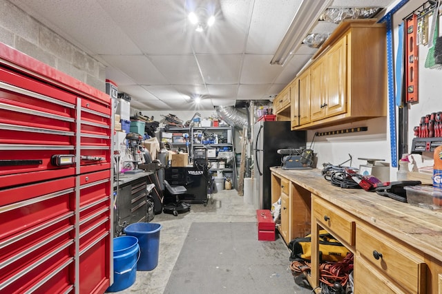 3615 Legacy Dr, Springfield, TN 37172 - garage featuring a workshop area and freestanding refrigerator