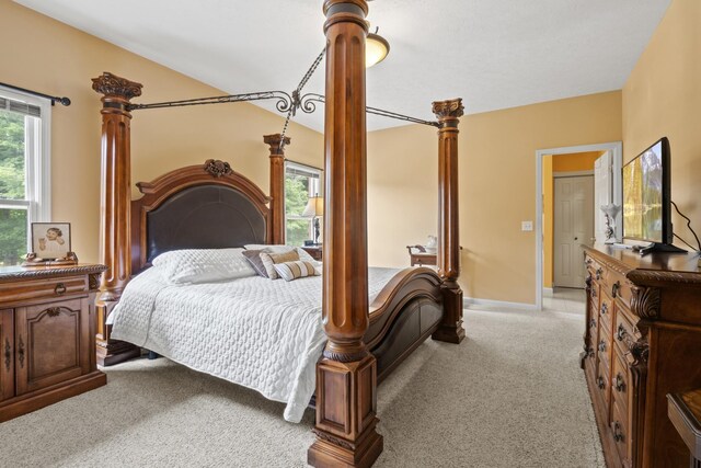 3615 Legacy Dr, Springfield, TN 37172 - bedroom with light colored carpet, baseboards, and ornate columns