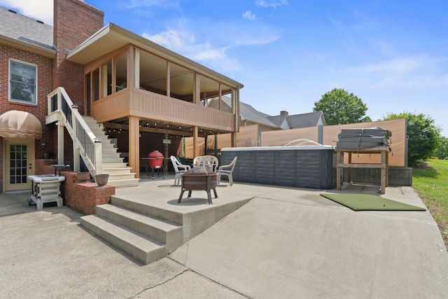 3615 Legacy Dr, Springfield, TN 37172 - back of property with a patio area, a chimney, stairway, brick siding, and an outdoor living space with a fire pit