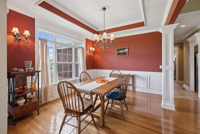 4322 Thoroughbred Ln, Murfreesboro, TN 37127 - dining room featuring ornate columns, healthy amount of natural light, crown molding, hardwood / wood-style floors, and a decorative wall