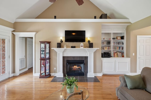 4322 Thoroughbred Ln, Murfreesboro, TN 37127 - living room with a tiled fireplace, wood finished floors, built in features, high vaulted ceiling, and a ceiling fan