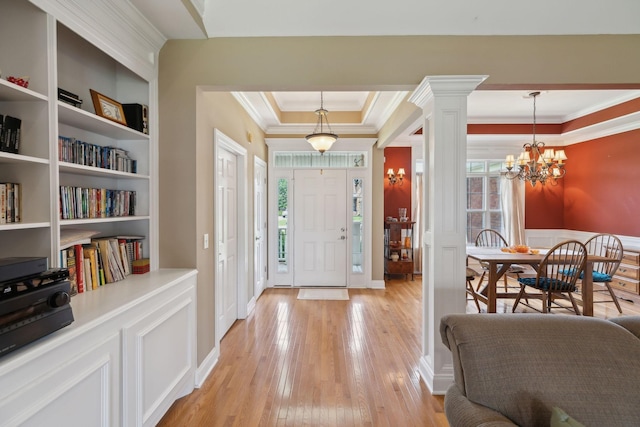 4322 Thoroughbred Ln, Murfreesboro, TN 37127 - foyer with ornamental molding, light wood-style flooring, a chandelier, a raised ceiling, and ornate columns