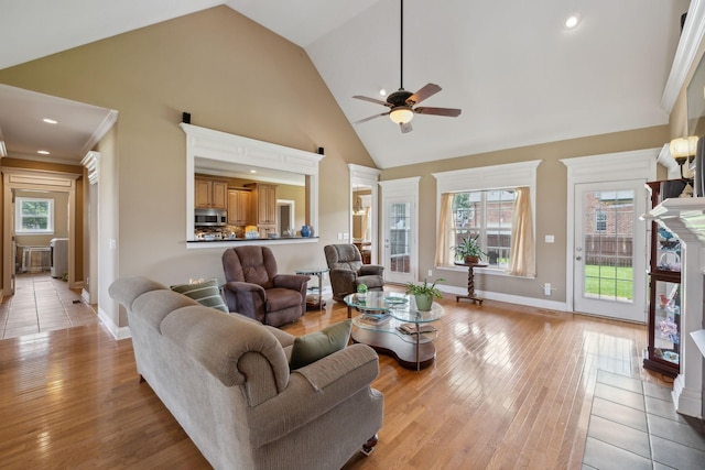 4322 Thoroughbred Ln, Murfreesboro, TN 37127 - living room with a ceiling fan, plenty of natural light, light wood finished floors, high vaulted ceiling, and baseboards