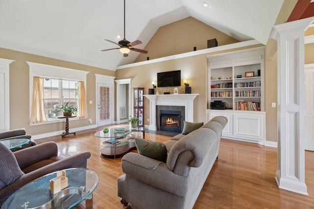 4322 Thoroughbred Ln, Murfreesboro, TN 37127 - living room with lofted ceiling, ornate columns, a ceiling fan, a tile fireplace, and light wood-style floors
