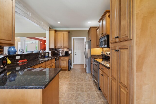 4322 Thoroughbred Ln, Murfreesboro, TN 37127 - kitchen with stainless steel appliances, ornate columns, a sink, tasteful backsplash, and ornamental molding