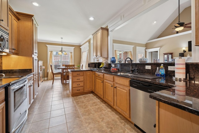 4322 Thoroughbred Ln, Murfreesboro, TN 37127 - kitchen with stainless steel appliances, backsplash, a sink, crown molding, and a peninsula