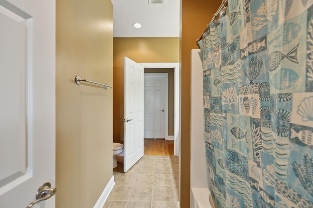 4322 Thoroughbred Ln, Murfreesboro, TN 37127 - bathroom with toilet, baseboards, shower / bathtub combination with curtain, and tile patterned flooring