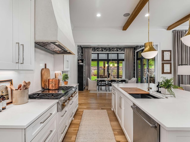 9021 Passiflora Ct, College Grove, TN 37046 - kitchen with appliances with stainless steel finishes, a sink, custom exhaust hood, beamed ceiling, and light wood-type flooring