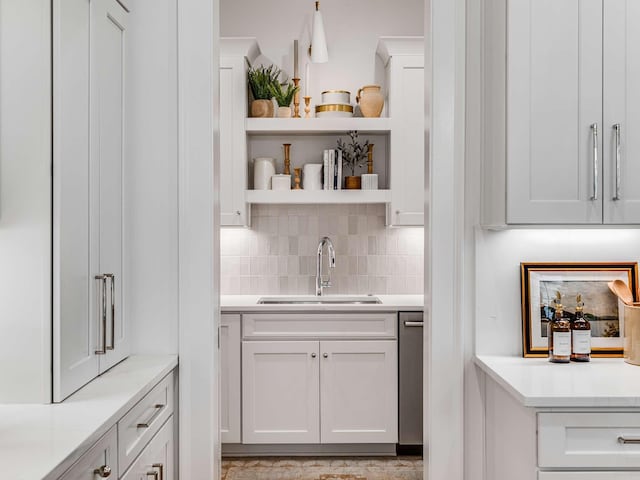 9021 Passiflora Ct, College Grove, TN 37046 - bar with a sink, backsplash, and stainless steel dishwasher