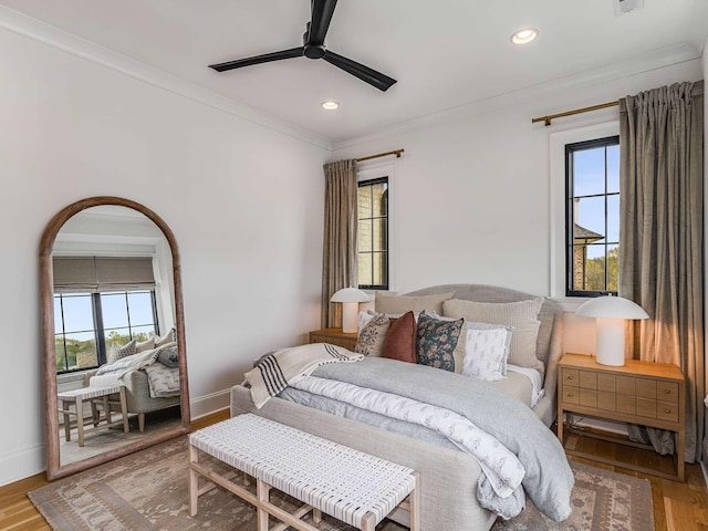 9021 Passiflora Ct, College Grove, TN 37046 - bedroom with multiple windows, crown molding, light wood-type flooring, recessed lighting, and baseboards