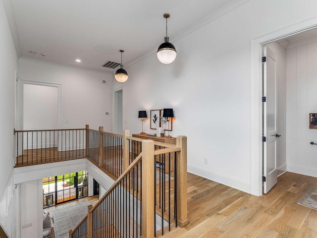 9021 Passiflora Ct, College Grove, TN 37046 - hallway with an upstairs landing, wood finished floors, crown molding, baseboards, and recessed lighting