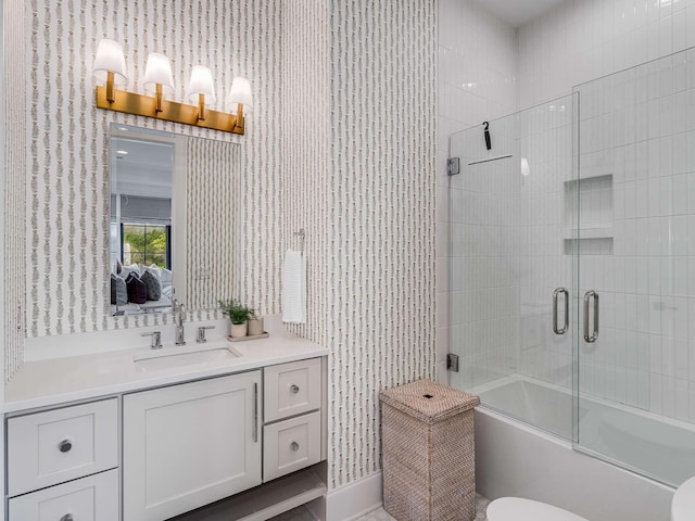 9021 Passiflora Ct, College Grove, TN 37046 - bathroom with vanity, toilet, shower / bath combination with glass door, and wallpapered walls