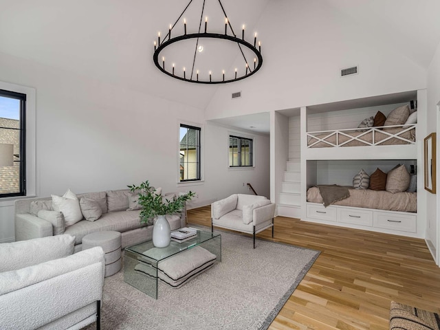 9021 Passiflora Ct, College Grove, TN 37046 - living area with light wood-style floors, a chandelier, and high vaulted ceiling