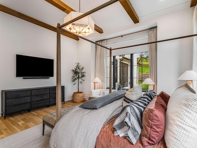 9021 Passiflora Ct, College Grove, TN 37046 - bedroom with a chandelier, beam ceiling, and wood finished floors