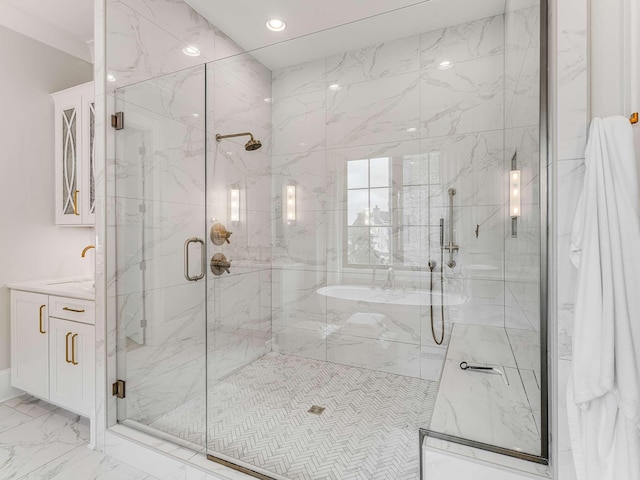 9021 Passiflora Ct, College Grove, TN 37046 - bathroom featuring marble look tile flooring, a marble finish shower, vanity, and recessed lighting