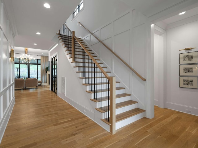 9021 Passiflora Ct, College Grove, TN 37046 - stairs with a chandelier, wood finished floors, recessed lighting, and baseboards
