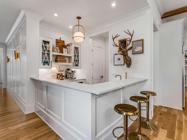 9021 Passiflora Ct, College Grove, TN 37046 - bar with light wood-style flooring, crown molding, recessed lighting, and pendant lighting