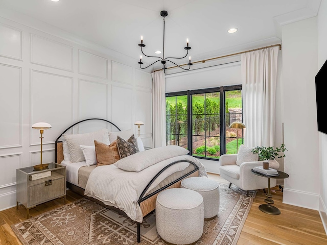 9021 Passiflora Ct, College Grove, TN 37046 - bedroom featuring a decorative wall, a chandelier, light wood-style floors, recessed lighting, and baseboards