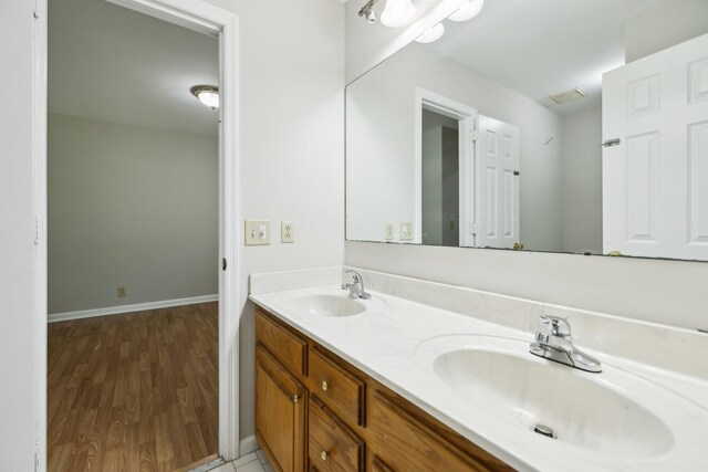 3031 Hartford Dr, Murfreesboro, TN 37129 - full bath featuring double vanity, wood finished floors, and baseboards