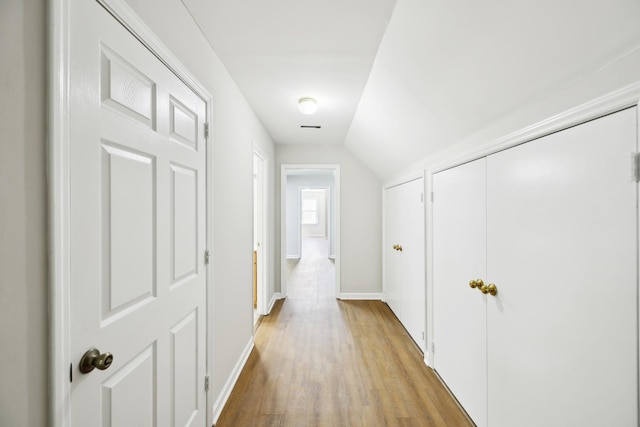 3031 Hartford Dr, Murfreesboro, TN 37129 - corridor featuring light wood finished floors, vaulted ceiling, and baseboards