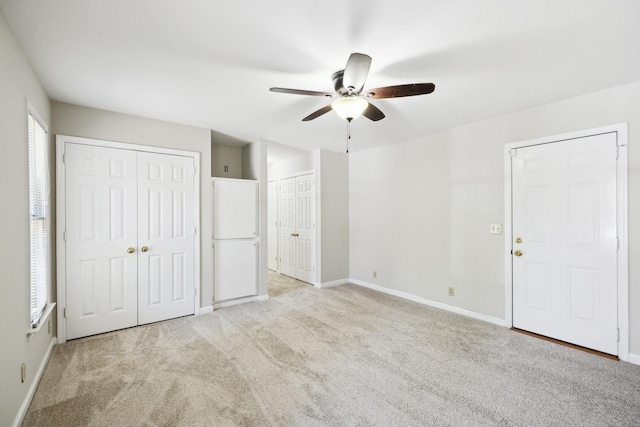 3031 Hartford Dr, Murfreesboro, TN 37129 - unfurnished bedroom featuring two closets, light colored carpet, baseboards, and a ceiling fan