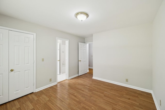 3031 Hartford Dr, Murfreesboro, TN 37129 - unfurnished bedroom featuring light wood finished floors, baseboards, and ensuite bath
