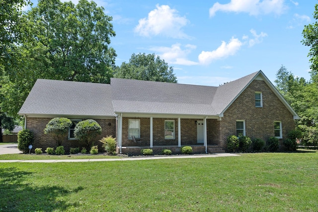 3031 Hartford Dr, Murfreesboro, TN 37129 - view of front of home featuring brick siding, a front lawn, a porch, and a shingled roof
