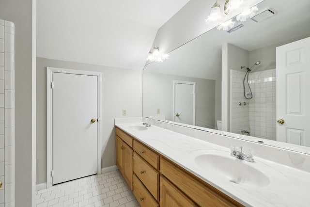 3031 Hartford Dr, Murfreesboro, TN 37129 - bathroom featuring double vanity, tiled shower, toilet, lofted ceiling, and baseboards