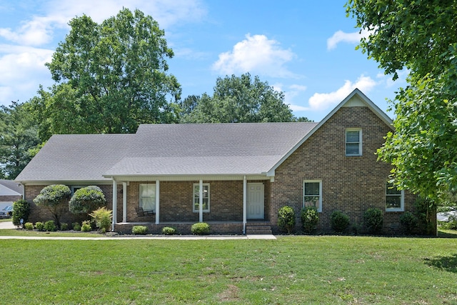 3031 Hartford Dr, Murfreesboro, TN 37129 - view of front of property featuring brick siding, a front yard, covered porch, and a shingled roof