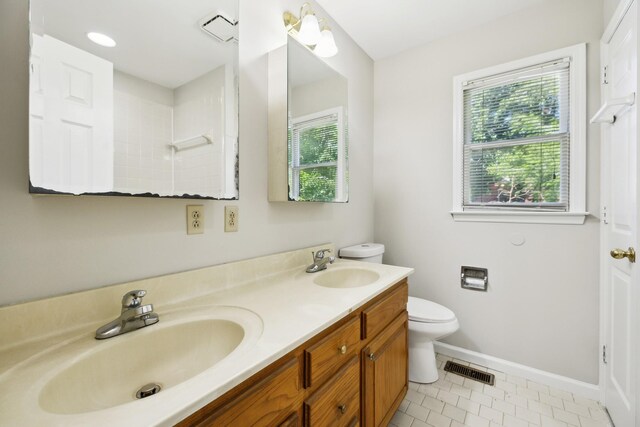 3031 Hartford Dr, Murfreesboro, TN 37129 - full bathroom featuring toilet, double vanity, baseboards, tile patterned floors, and a shower