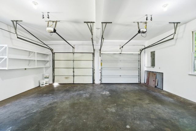 3031 Hartford Dr, Murfreesboro, TN 37129 - garage featuring electric panel and a garage door opener
