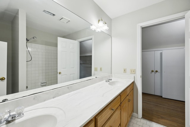 3031 Hartford Dr, Murfreesboro, TN 37129 - bathroom with double vanity, tiled shower, and tile patterned floors