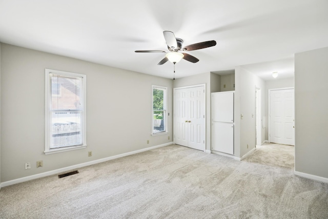 3031 Hartford Dr, Murfreesboro, TN 37129 - unfurnished bedroom with multiple windows, light colored carpet, baseboards, and ceiling fan