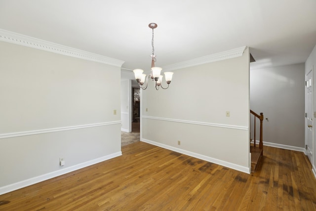 3031 Hartford Dr, Murfreesboro, TN 37129 - empty room with a chandelier, wood finished floors, baseboards, and ornamental molding