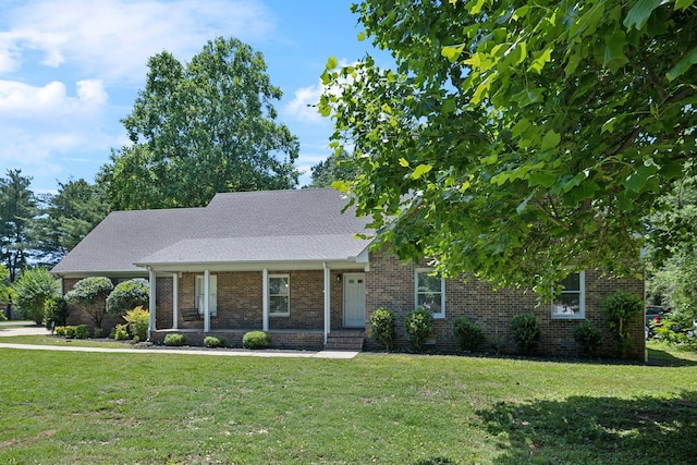 3031 Hartford Dr, Murfreesboro, TN 37129 - view of front of property featuring covered porch, brick siding, and a front yard