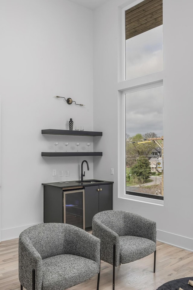 2801A W Kirkwood Ave, Nashville, TN 37204 - indoor wet bar with wine cooler, light wood finished floors, and baseboards