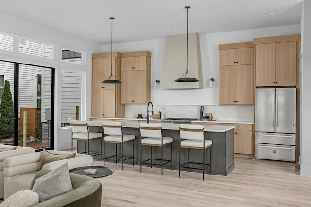 2801A W Kirkwood Ave, Nashville, TN 37204 - kitchen featuring stainless steel refrigerator, light brown cabinets, light countertops, a kitchen island with sink, and recessed lighting