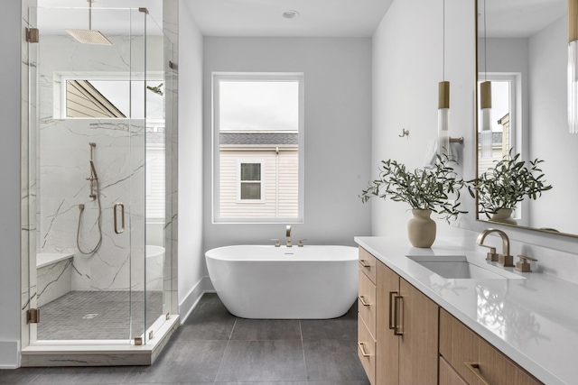 2801A W Kirkwood Ave, Nashville, TN 37204 - bathroom with a marble finish shower, vanity, a freestanding bath, tile patterned flooring, and baseboards
