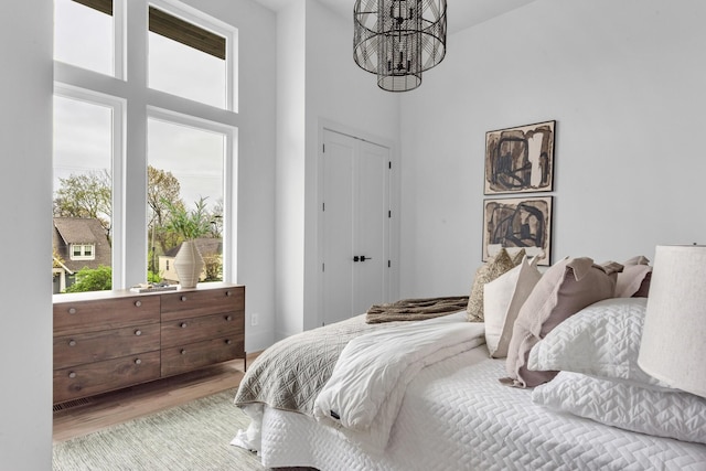 2801A W Kirkwood Ave, Nashville, TN 37204 - bedroom featuring wood finished floors, a chandelier, and a high ceiling