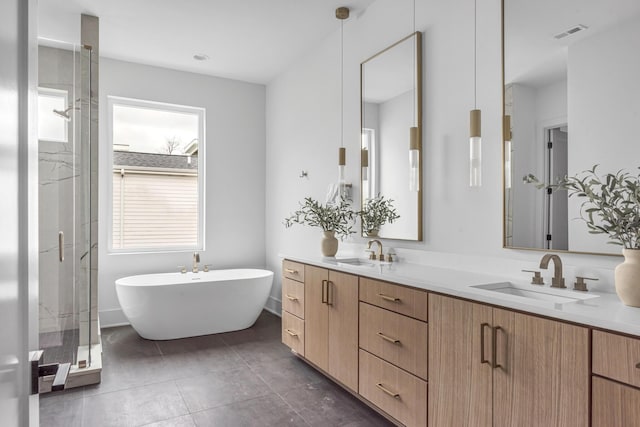 2801A W Kirkwood Ave, Nashville, TN 37204 - bathroom featuring double vanity, a freestanding bath, a shower stall, and tile patterned floors