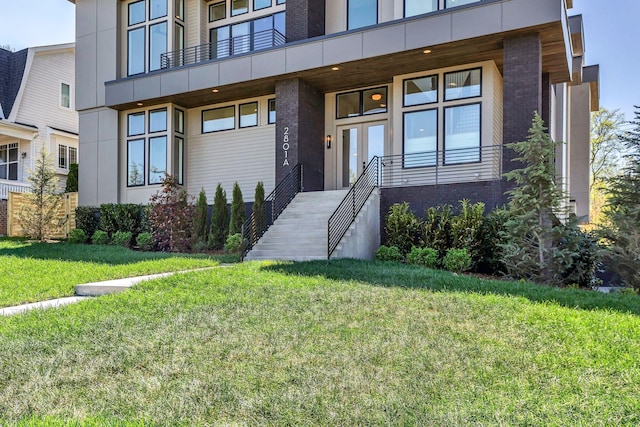 2801A W Kirkwood Ave, Nashville, TN 37204 - property entrance with a lawn, brick siding, and a balcony