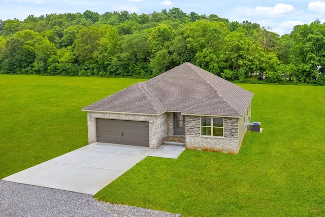 1928 Flats Rd, Cunningham, TN 37052 - view of front of home with an attached garage, driveway, a front lawn, and central air condition unit