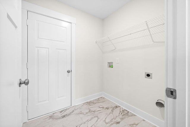 1928 Flats Rd, Cunningham, TN 37052 - laundry room with light marble finish flooring, electric dryer hookup, baseboards, and washer hookup