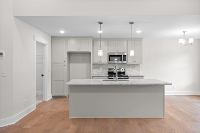 1928 Flats Rd, Cunningham, TN 37052 - kitchen featuring stainless steel appliances, baseboards, light wood-style floors, a sink, and recessed lighting