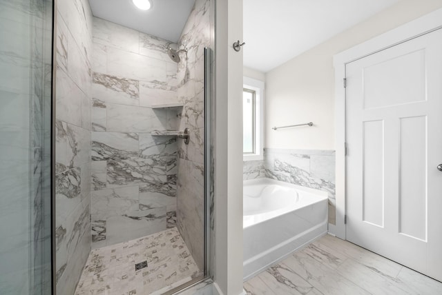 1928 Flats Rd, Cunningham, TN 37052 - bathroom featuring a garden tub, a marble finish shower, and marble look tile flooring