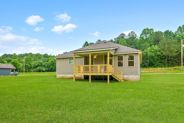 1928 Flats Rd, Cunningham, TN 37052 - back of house with a lawn, roof with shingles, a deck, crawl space, and stairway